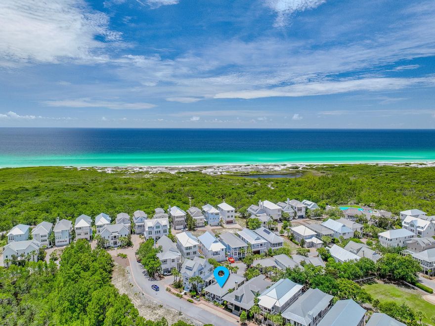 Charming one-level beach cottage nestled in a gated coastal community along 30A. This thoughtfully designed 3-bedroom, 2.5-bath home features vaulted ceilings, rich hardwood floors, and an open-concept layout perfect for relaxed beachside living. The kitchen is bright and coastal with white cabinetry, granite countertops, and stainless steel appliances. Enjoy peaceful mornings and breezy evenings on both the front and rear covered porches. Community amenities are truly resort-style--including an infinity-edge pool overlooking the dunes, a second owner's pool, hot tub, fitness center, tennis courts, and a clubhouse. Your ideal beach retreat awaits!