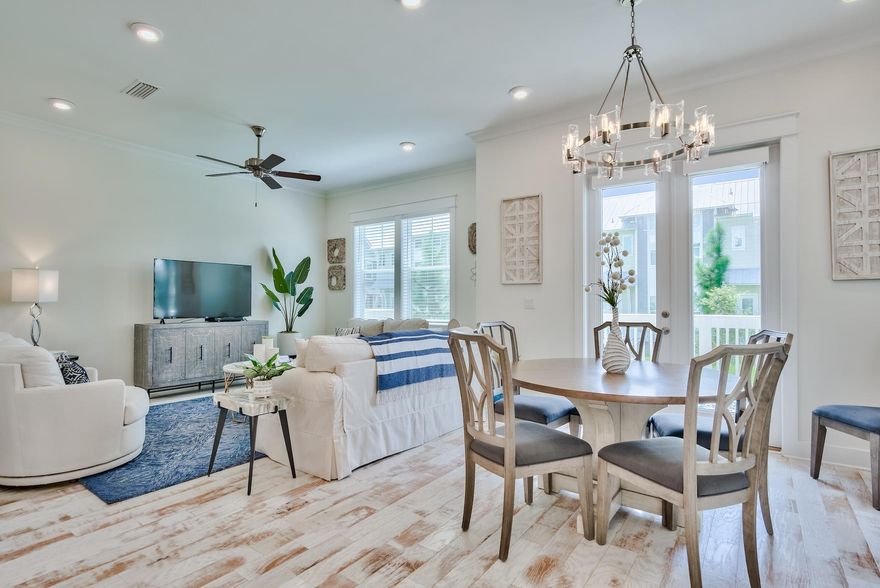 Luxurious and serene is the setting for this immaculate and gorgeous 3-bedroom townhome located in Prominence North backing up to the largest green space; offering tranquility and privacy. Professionally decorated throughout with plush furnishings in neutral navy, white and gorgeous blues offers a relaxed and peaceful feeling the moment you enter this expertly designed Cozumel floor plan. From the light hardwood floors throughout, abundance of bright & natural light, gorgeous quartz countertops, custom cabinetry to the gorgeous glass mosaic tiled backsplash, this amazing townhome is sure to be a secluded oasis and coastal retreat from the modern world! Coming fully furnished featuring 3 bedrooms, 2.5 baths, and a two-car garage combined with a strong rental projection of $50,000 per year.