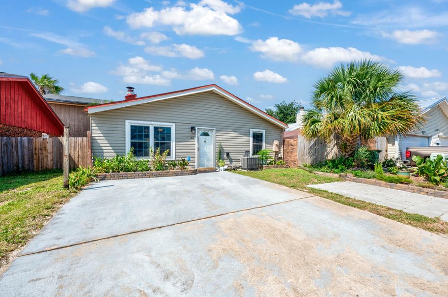 **BACK ACTIVE AT NO FAULT TO THE SELLER. BRAND NEW ROOF. This property offers tons of inspiration already in place, just bring your green thumb. The floor plan is ready for you to entertain, with kitchen island and breakfast bar, an ample dining area, and a living room with a wood-burning fireplace. The primary bedroom is situated near the rear of the home and that boasts an en-suite bathroom complete with walk-in shower and access to an enclosed porch and the back yard. You'll enjoy the sun-sail covered deck off of the kitchen, as much as raised beds in the back and a gate providing direct access to the neighborhood playground.  Only 5 miles from Destin Commons amenities and 2 miles from the beach. Check out our full video tour on the MLS and YouTube. Only 5 miles from Destin Commons amenities and 2 miles from the beach. Check out our full video tour on the MLS and YouTube