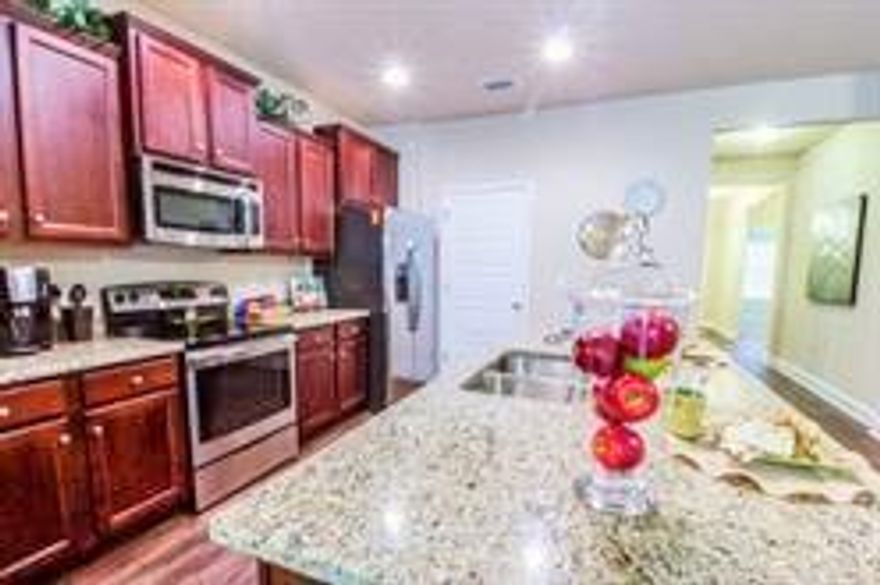 The Lamar is a one story floor plan, featuring 3 bedrooms, 2 baths, covered back porch & 2 car garage. The open kitchen features an island, stainless steel appliances and granite countertops. The kitchen opens to the great room w/ access to the back covered porch. The master bedroom is just off the back side of the house & master bathroom features a walk in closet, separate 5' tile shower, dual sinks & large tub. Listing Broker/Sales Associate has ownership interest in the property. Photos are of a similar home.