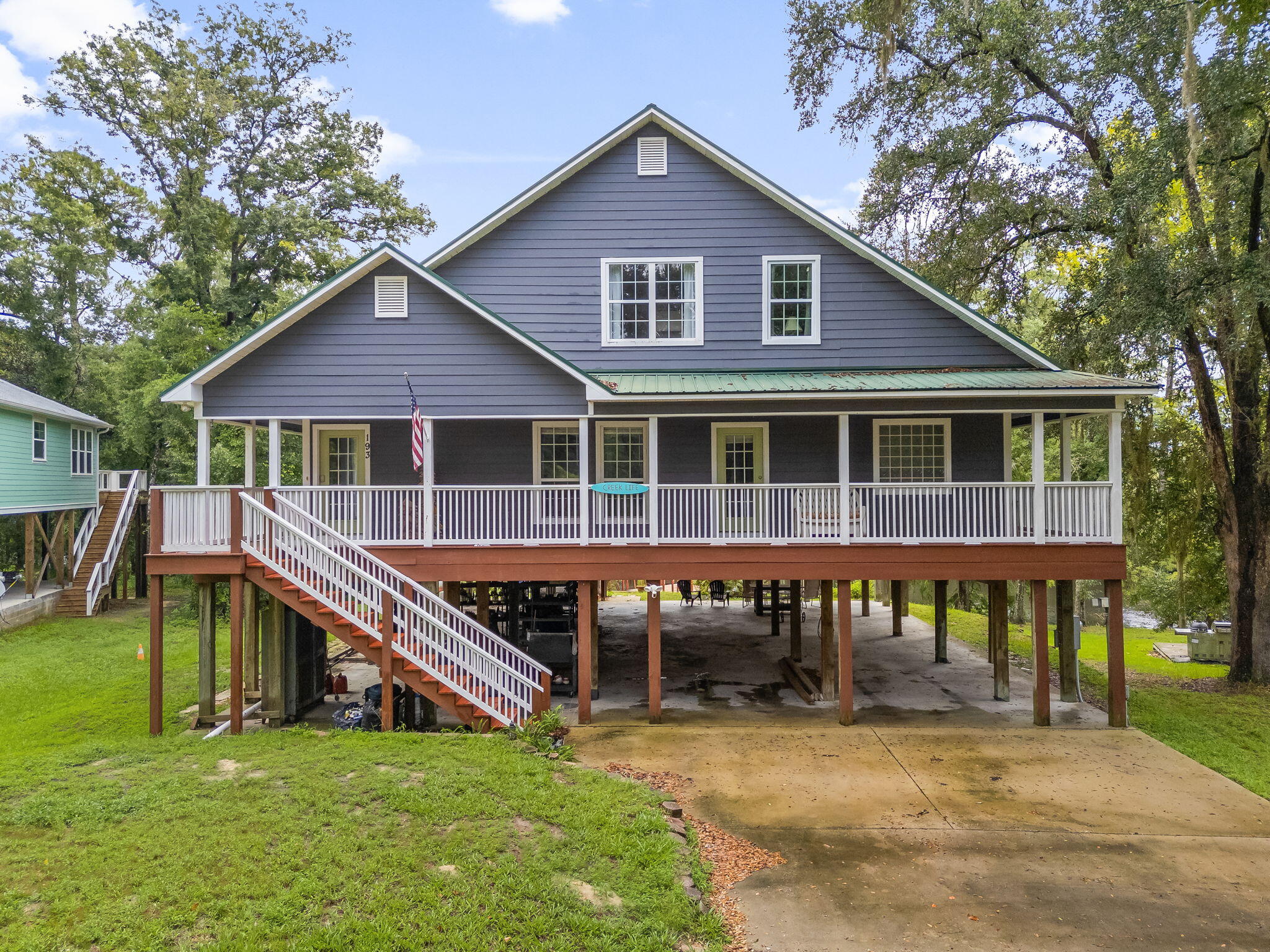 Deep-water access with boat slip! This high-elevation waterfront home features a 15' deep water dock and slip just minutes to Choctawhatchee Bay. Located on a quiet street with a public boat launch nearby, the property offers new LVP flooring throughout, new dock decking, and spacious living areas on both levels--ideal for entertaining or rental potential. Enjoy the wraparound porch (partially screened), a private beach area for launching kayaks or paddleboards, and abundant wildlife views. No HOA. Elevation certificate shows 20' elevation; flood insurance under $500/year. Centrally located for quick access to work or the beach--perfect for full-time living or a vacation getaway!