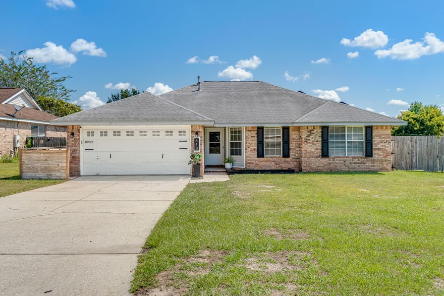 Stylish & Move-In Ready on a Prime Corner Lot. Located in South Crestview's Steeplechase neighborhood. Enjoy low energy bills with paid off solar panels. The home features a semi-open layout with granite countertops, stainless steel appliances, and electric/gas stove hookups. Modern ceiling fans and updated lighting add a fresh, contemporary touch throughout. The split-bedroom design ensures privacy, and the master suite includes a beautifully tiled shower. Outside, enjoy a fully fenced, manicured backyard with a cozy patio, out door patio furniture convey with the home--perfect for relaxing or entertaining. A blend of comfort, charm, and convenience--schedule your showing today!