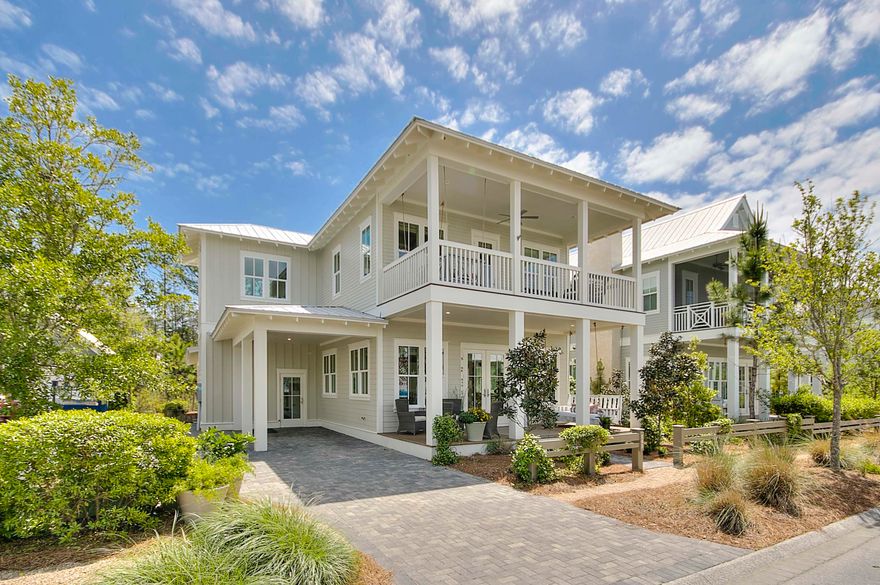 Welcome to 145 Sunflower, a well cared for home in WaterColor's Crossings District. This like new Romair residence is professionally decorated and has never been on a vacation rental program. Welcoming front porch opens into a spacious open living, dining and kitchen floorplan. Large first floor master suite/bath located on the back of the home offers privacy. Back screened in porch with fireplace, living and dining areas is super oversized,additional living space not included in the sq. footage. Natural preserve area off porch for peace and tranquility. Carport entry houses cubbies and hooks for all of your beach necessities. Wide, bright stairwell to open 2nd floor landing and 4 built in bunk beds each with its own cable hookup. Second floor master suite with double vanities a