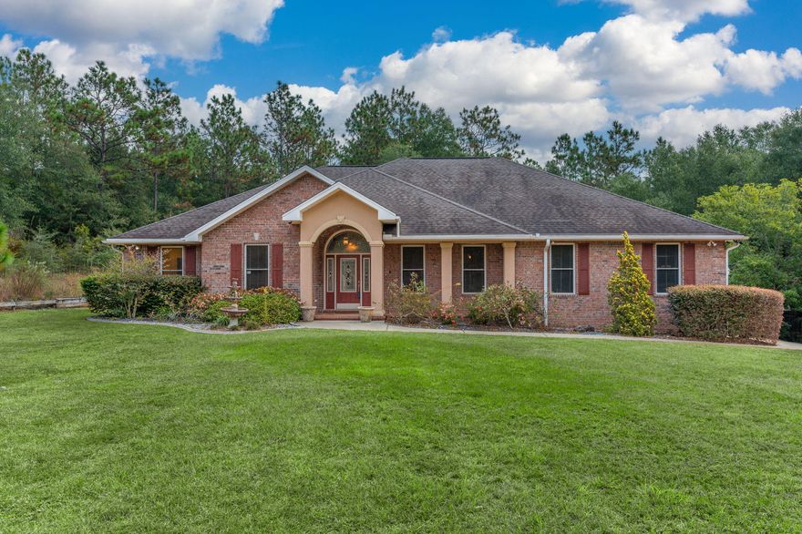 This stunning custom home with pool, an extra detached garage, and on a serene 3.55 acres is a definite must see.  You feel like  you're in the country but just a short distance to local stores and restaurants.  This quality home has 2 master suites and a study that was used as a third bedroom.  Upon entering the home you are greeted with a stunning foyer , crown molding throughout, oversize baseboards.  to the right is a large dining room with double tray ceilings and new laminate flooring.  As you continue through the foyer you enter the formal living area that leads to the covered patio and swimming pool with new liner.  To the right of the formal living room is the family room and kitchen with granite countertops.  The grand master suite with its tray ceilings and large bath oasis can