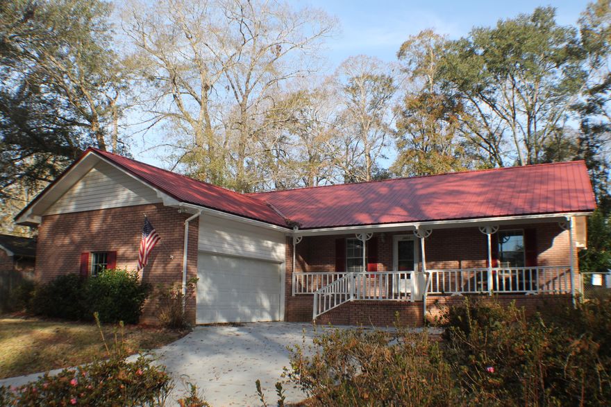 Beautiful all brick home on a Hardwood lot close to Schoos,shoppinhg,banks and Military bases! Enjoy the rocking chair porch ,the grilling porch and the Florida room! Huge open living area with vaulted ceiling, large kitchen with stainless appliances. Split floor plan ,three bedroom three bath! Built to last metal roof with two outside sheds for lawn equipment and storage! Home Sweet Home!