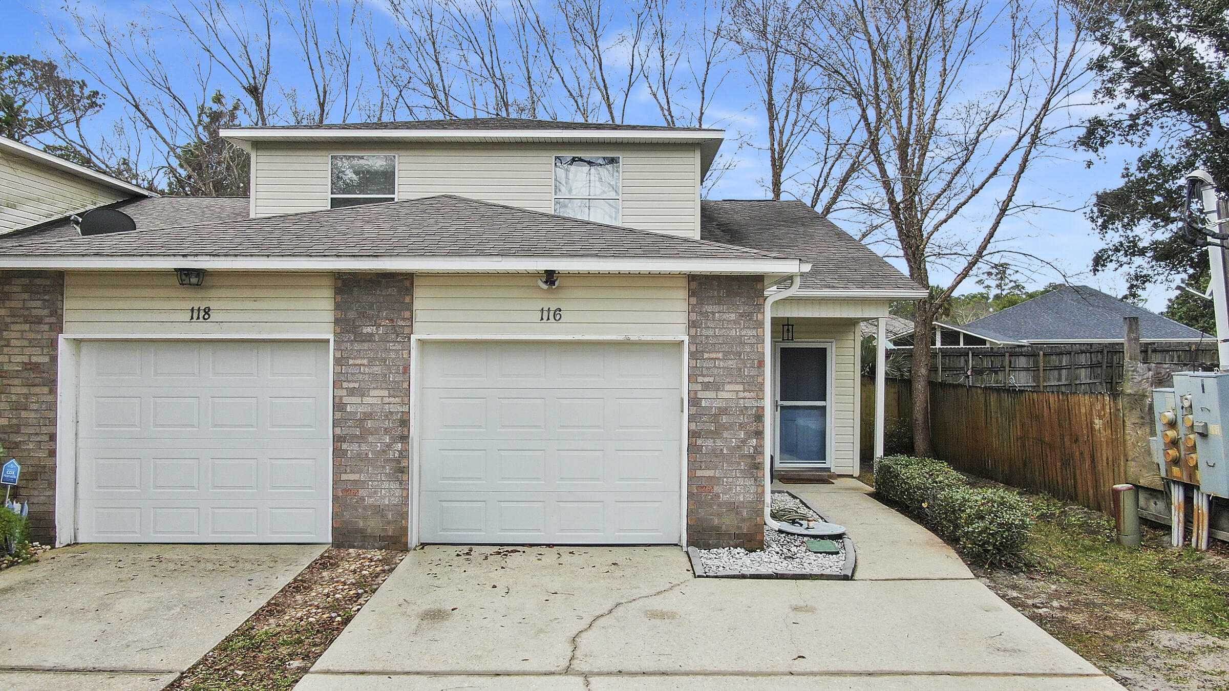 Wonderful location! Recent improvements include new HVAC system, water heater, laminate flooring, and carpet on stairs . End unit with 2 large driveway spaces for you or your guests/roommate and an attached 1-car garage. Just 2.2 miles from Hurlburt Field. Impeccably maintained property, freshly painted with a roomy kitchen and an open living space. The main areas showcase beautiful porcelain tile floors for easy maintenance. The primary bedroom is spacious with a walk-in closet and access to the 4-season room. Privacy is ensured with a split bedroom layout, providing ample space for everyone.