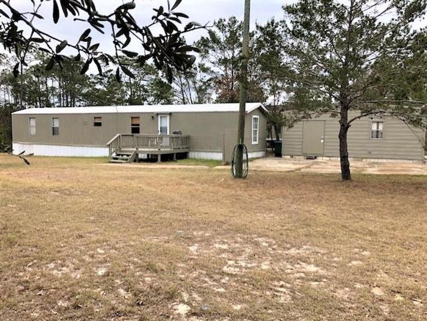 Sale includes two parcels: 1936 Ambassador with mobile home (.31A) & 1940 Ambassador-vacant land (.68A). Mobile home would make great vacation get-away, hunting camp or rental OR live in it while building your dream home! Just off Hwy. 98 & convenient to sugar-white, sandy beaches, golf, Gulf Breeze Zoo, famous Gulf Breeze Flea Market, shopping, medical facilities & Gulf Islands National Seashore! 12x24 workshop has electricity, roll-up door & ceiling fan. 
 Exterior recently painted.  Property selling AS-IS.