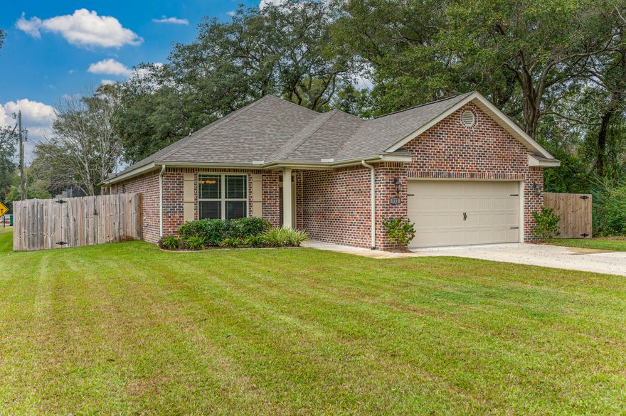 Watree built, in 2020 and ready for new owners. With 4 bedroom and  2 bathrooms, and plenty of space on the side of the yard for a boat or RV.  There is a parking pad already in place. Home is located in the center of Niceville and only minutes to Eglin AFB. With the large driveway you will not be lackying for space to all your vehicles. Spacious back yard for your entertaining fun anchored by an old Majestic Oak tree. The home has a split bedroom design with an open floor plan. Kitchen offers granite countertops, tiled backsplash, stainless appliances and dark cabinets. The living area has modern tile flooring, while the bedrooms have carpet. Next to the kitchen is a formal dining room. The master bedroom includes a trayed ceiling.