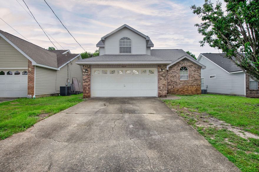 VA Assumable loan at 2.75%!Step inside and discover the charm and functionality this home has to offer. The main living area boasts a striking wood-burning fireplace framed in modern white stone, complemented by cathedral ceilings and an abundance of natural light from two large windows and a sliding glass door. The spacious kitchen includes ample counter and cabinet space, along with a cozy eat-in dining area perfect for everyday meals or casual entertaining. The primary bedroom is conveniently located on the first floor, offering a private retreat with an en-suite bathroom featuring a double vanity, soaking tub, and separate shower. Upstairs, you'll find two additional bedrooms and a full bathroom ideal for family, guests, or a home office. Enjoy the comfort, space, and natural light.