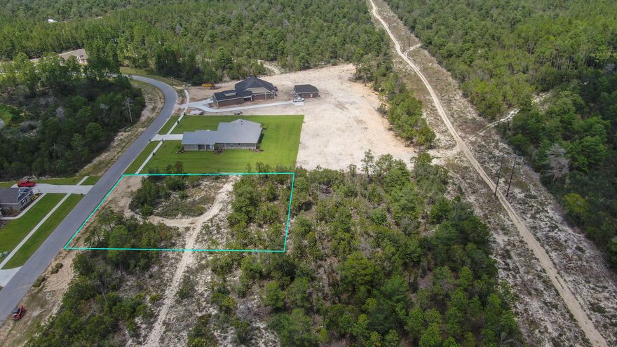 This large 1.44 acre lot offers privacy as it backs up to over 600 acres of private land and is a great location to build your custom home. Windswept Estates is a beautifully developed premier gated golf course community offering very generous building sites that surround the 5-star, 18-hole Windswept Dunes Golf Club. Located just 15 minutes North of the picturesque, white sand beaches and turquoise waters of the Florida Panhandle's Gulf of Mexico. The natural topography of the sweeping sand dunes provides a sense of privacy between the homes and the well-maintained golf course. Some of the community amenities include a large swimming pool and clubhouse, two tennis courts, basketball court, and a safe playground facility. Windswept Estates is the perfect spot to call ''HOME''.