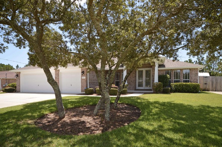 Exceptional Custom-Built Pool Home with gunite pool, 3-car garage and enclosed lanai . Home has 2676 sq. ft., 4 Bdrms, 3 Full Baths, with Open and Split Floor plan. Built in 2008 in Holley by the Sea with membership to the HOA Lifestyle Center. Home features: custom cantilevered cabinets, stainless steel appliances, and a center island. Granite countertops in kitchen and Baths. Tile floors, raised ceilings, custom lighting and ceiling fans. . Home has many custom features such as crown, shelving, extra storage, hobby/craft room, corner bead, knockdown ceilings, garage workshop, screened-in patio area great for entertaining. Pool is enclosed with clear solid roof, convenient in any weather. Lawn is manicured and looks like an oasis. Lawn Pump and Parking Pad for Boat/RV.