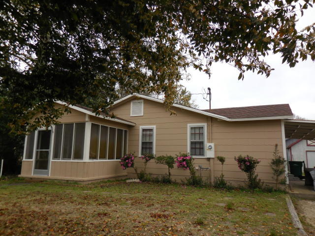 Cute and Comfortable! This 2-bedroom and 1-bath home is a perfect starter home. Walk into your large living room which has plenty of room for corner office area too! The kitchen also features a dining area. Off the kitchen and dining area is the laundry room (washer and dryer are as-is) and a large storage closet and the side entry. The backyard includes a convenient storage shed, a delicious fig tree and, yes, a giant blueberry tree! The yard is completely fenced except across the driveway. To complete the picture is an adorable screened in front patio to relax in. New roof in 2020. New water heater in 2023. New plumbing and kitchen floor in 2022. (Swing on patio does not convey.)