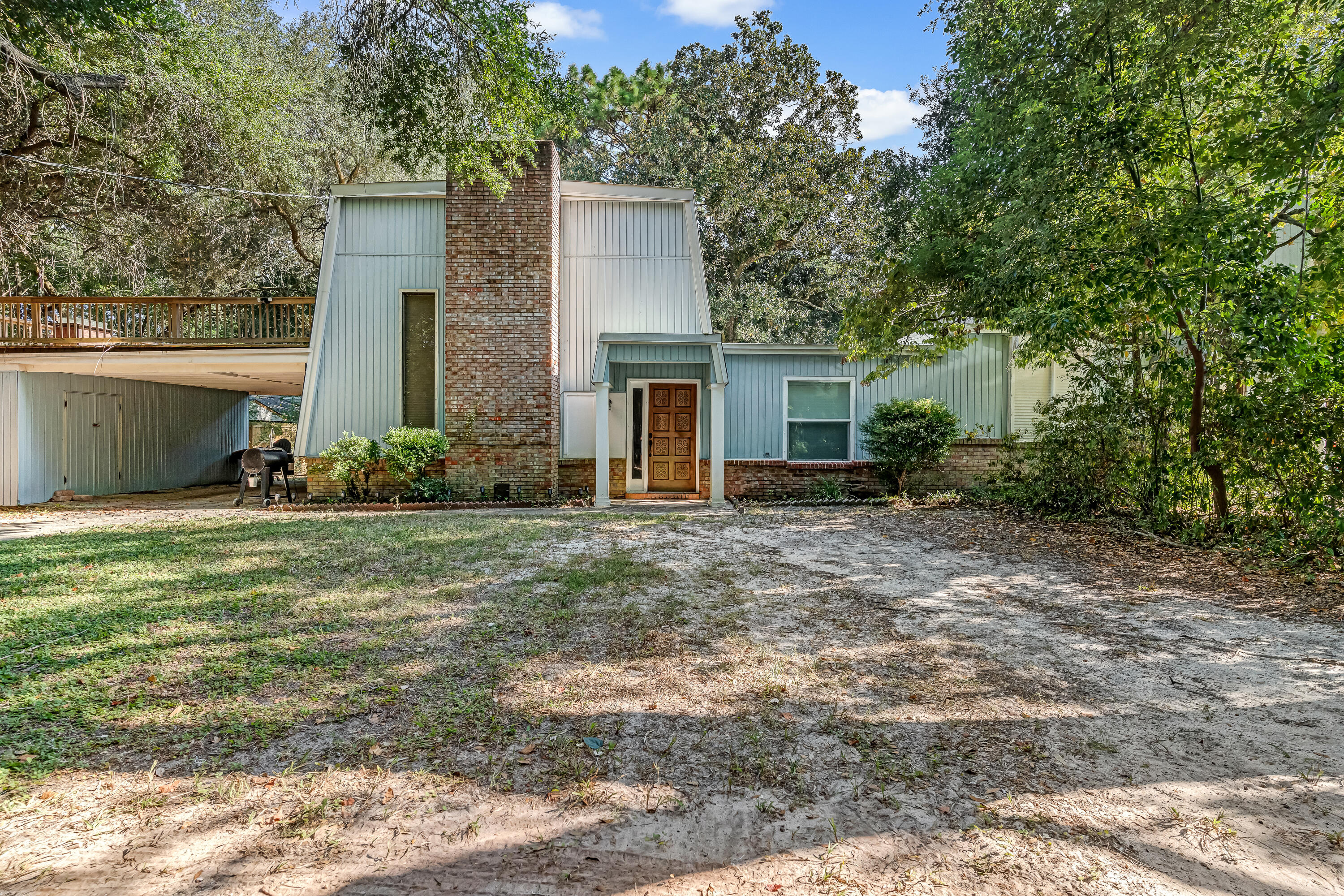 Welcome to your beautifully renovated retreat on a quiet dead end! This home has been updated from top to bottom, featuring soaring ceilings, a stunning brick wood-burning fireplace, and an open chef's kitchen with quartz island, stainless steel appliances, range hood, and tile backsplash.The first floor offers two spacious bedrooms, a full bath with tiled shower, and a half bath. Upstairs, the primary suite includes a private balcony, walk-in closet, and spa-like bath with granite vanity and tiled shower. Enjoy outdoor living from the second-floor patio or the enclosed Florida room overlooking the fenced backyard with mature trees.Upgrades include 2023 Roof, 2023 HVAC, instant hot water heater, new windows, French doors, flooring, and lighting. Conveniently located near schools, shopping, dining, Eglin AFB (4 mi), Hurlburt Field (9 mi), and the beach (6 mi).