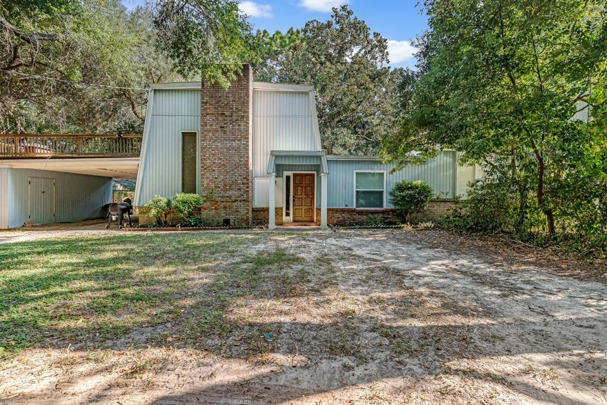 Welcome to your beautifully renovated retreat on a quiet dead end! This home has been updated from top to bottom, featuring soaring ceilings, a stunning brick wood-burning fireplace, and an open chef's kitchen with quartz island, stainless steel appliances, range hood, and tile backsplash.The first floor offers two spacious bedrooms, a full bath with tiled shower, and a half bath. Upstairs, the primary suite includes a private balcony, walk-in closet, and spa-like bath with granite vanity and tiled shower. Enjoy outdoor living from the second-floor patio or the enclosed Florida room overlooking the fenced backyard with mature trees.Upgrades include 2023 Roof, 2023 HVAC, instant hot water heater, new windows, French doors, flooring, and lighting. Conveniently located near schools, shopping, dining, Eglin AFB (4 mi), Hurlburt Field (9 mi), and the beach (6 mi).