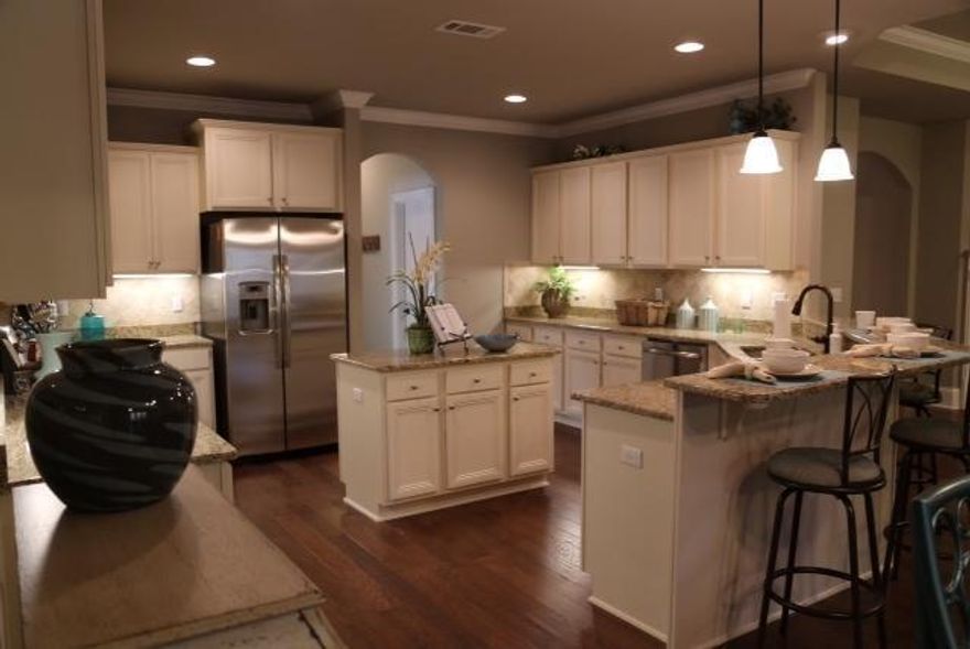 Beautiful and spacious home on a HUGE lot. This McKenzie plan is an open 5 bedroom 3 bath with a study and sunroom.Surrounded by magnolias and oak trees, the setting of this home is truly unique.*This is the community model home. Sold AS IS. Furniture not included.*