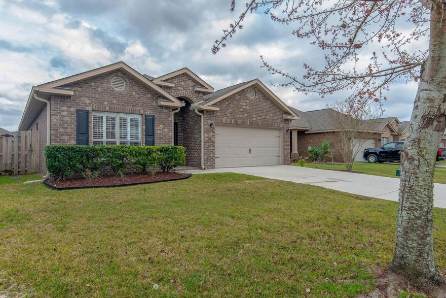 Stunning all brick home in much sought after Waterford Sound. Located between Navarre & Gulf Breeze, yet only 10-15min to the beautiful beaches. This 3 bedroom 2 bath home features a separate office with French doors, high ceilings, plantation shutters, tray ceilings & crown molding, upgraded 42'' upper cabinets in kitchen and laundry, and stainless appliances. Recently replaced the carpet and vinyl flooring. Master offers tray ceilings w/crown molding & a master bath that features a large garden tub, separate shower, double vanities and huge walk in closet. The exterior offers a large covered back porch, spacious back yard, sprinklers, and a fully fenced yard. For more info, call Navarre Beach Realty at 850-936-0701.No cats, but dogs may be considered with $350 nonrefundable pet fee.