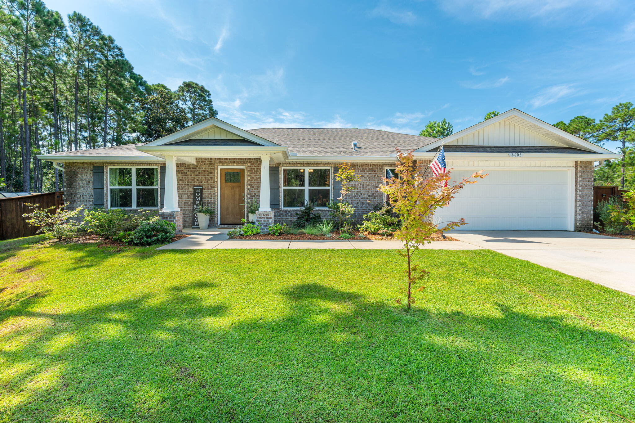 Welcome home to this 3BR/2BA Craftsman-style residence in Holley By The Sea. Built in 2020, this thoughtfully designed home offers approx. 2,093 sq ft on nearly half an acre. Step inside to an open floor plan with vaulted ceilings, recessed lighting, and durable vinyl plank flooring throughout. The spacious kitchen features granite counters, stainless appliances, 42'' cabinets, pantry, and a center island--perfect for gathering with family and friends. A dedicated office/den with French doors provides flexible space for work or hobbies. The primary suite offers a relaxing retreat with double vanities, shower, and walk-in closet. Enjoy the covered and screened in lanai overlooking the large backyard, ideal for outdoor living.