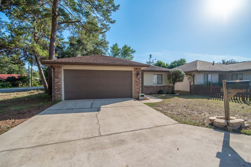 UPDATED TWO-BEDROOM TWO-BATH WITH FENCED IN YARD ON A CUL-DE-SACThis brick / vinyl siding home with a two-car garage is freshly updated and makes the perfect starter home for a couple, students or roommates. Features and upgrades include fresh paint throughout, indoor laundry room, vaulted ceiling in the living room with beautiful exposed wood beam, and laminate flooring throughout the main living area, with carpets in the bedroom. The split floor plan has one bedroom with an adjacent full bath with tub / shower combo at the front of the house.The living room and dining room share an open floor plan, with the kitchen off to one side and the main bedroom on the other.