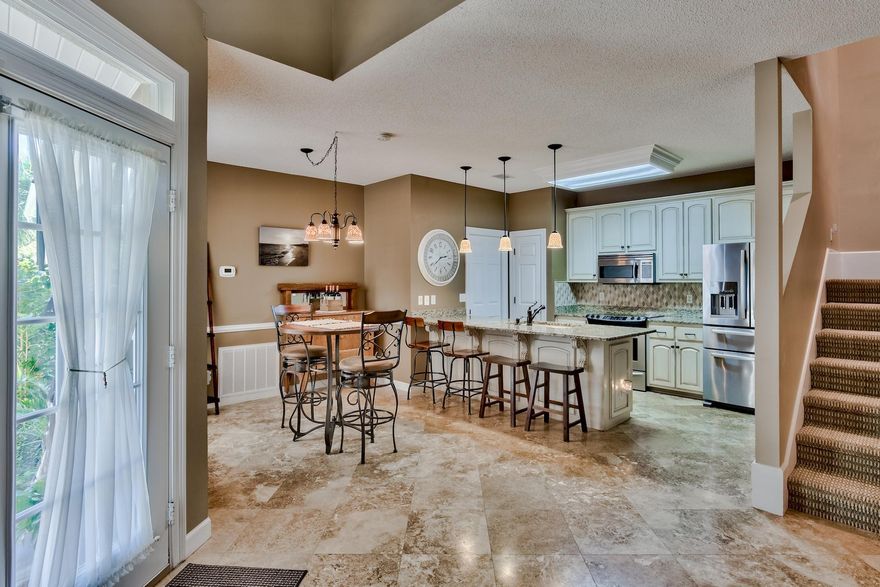 Must See ! This unit has been tastefully updated and well kept. It's a 2 story townhome 3 bd 2.5 ba located in the quiet neighborhood of Bon Villas. The community features a well run community association, a clean sparkling pool, access to the Bay, lighted tennis courts, kids park and is just a stones throw away to Silver Sands Outlet, Restaurants, and so much more. This unit features beautiful travertine tile and dark teak wood floors, new air conditioning unit, granite countertops, double french doors that lead to your backyard privacy with its own screened in patio, vaulted ceilings in living area, and so much more! Check out these pictures! Schedule your showing today!