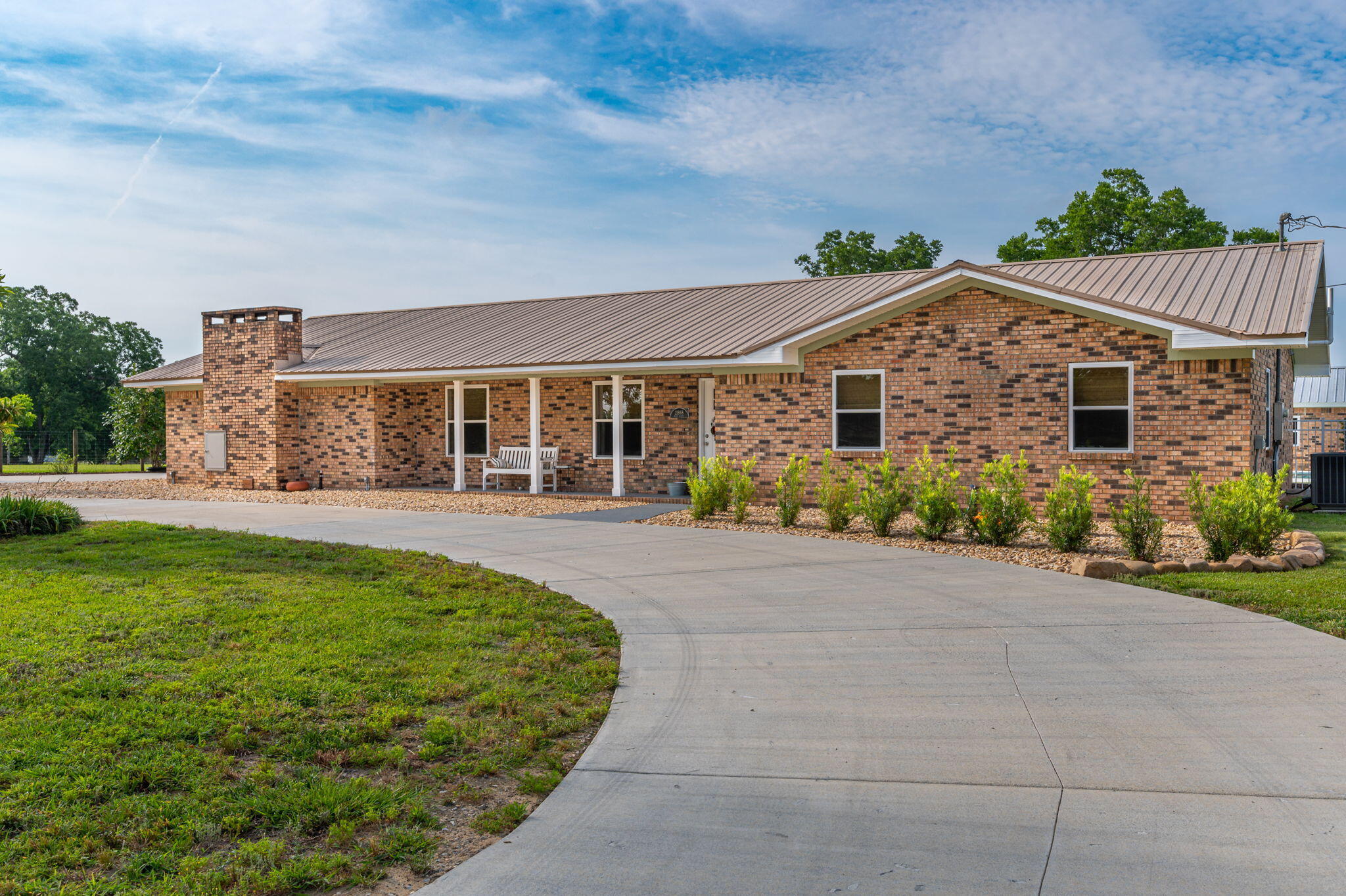 Located just over the Florida line less than a hour to the beaches, here is the dream property that checks every item on your list! This remolded home built in the 80's has been brought back to life with every detail carefully executed. Home welcomes you with a paved concrete circle drive, covered porch into an open foyer, a large living with fireplace, and a dining and kitchen with all the upgrades allowing for perfect entertaining. The master suite is amazing with plenty of room along a master bath with every detail and huge walk-in closet. The home offers 2 additional bedrooms and bath on this side of home and the left wing of the house also offers a large family room and the 4th bedroom. Home has a great covered attached carport, open patio, and inground pool.