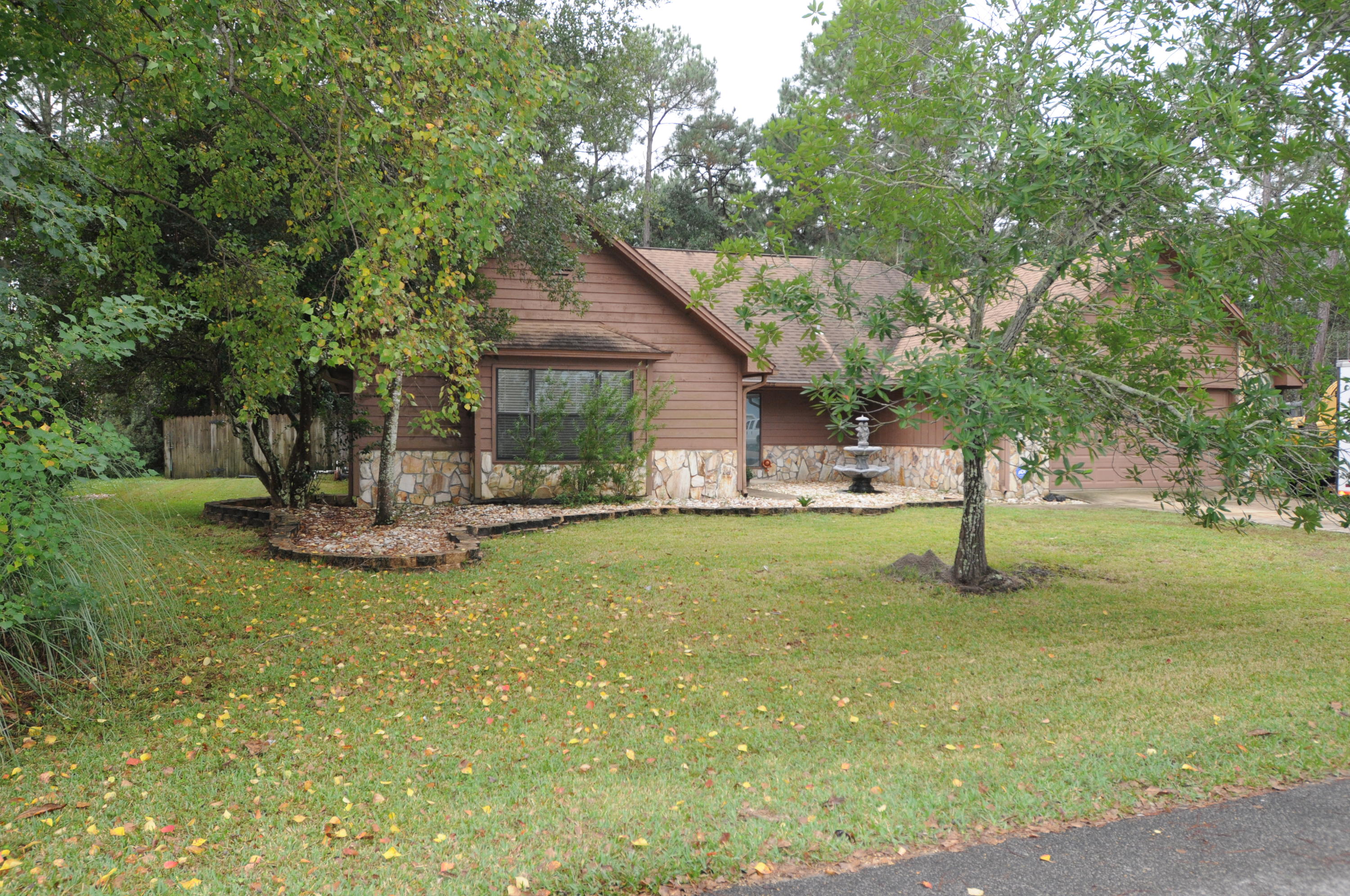 Freshly painted, lovely updated Bluewater Bay in ground POOL home. This is the one you have been waiting for: updated kitchen and baths, huge dining room with wet bar adjacent, large living area off of the entryway, wide plank engineered wood floors, bonus screened patio room overlooking .41 acre huge backyard with salt water in ground pool, hot tub, play area and shed. 3 large bedrooms all with walk in closets and 2 full baths with extensive tile work. Freshly painted interior, new built in microwave, new gas hot water heater for bedroom side of the home plus active termite bond. This home is a must see with access to all of Bluewater Bay's amenities and world class schools!