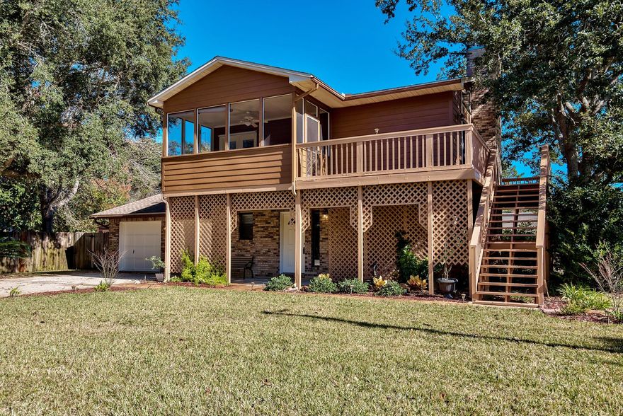 Ultimate tree house, enjoy the outdoors from a enclosed perspective 3/2.5/2 oversized garage. Waterfront community. Large corner landscaped lot. No HOA! Wood burning brick fire place. Cathedral ceiling lots of windows. Wrap around porch and screened in balcony made for relaxing rocking chairs, conversations, bird watching and art projects a perfect place for you to enjoy the seasons of your life. All new flooring, large Kitchen with extra counter space with all new stainless appliances, fresh paint in and out, outside shower,in ground sprinkler system, storm shutters. Never flooded. A short walk to the tree lined park with picnic area and boat ramp ready to launch your boat. Lot of room extra spaces for parking and keeping all your toys, jet ski's, boats or RV. Home Home at last!