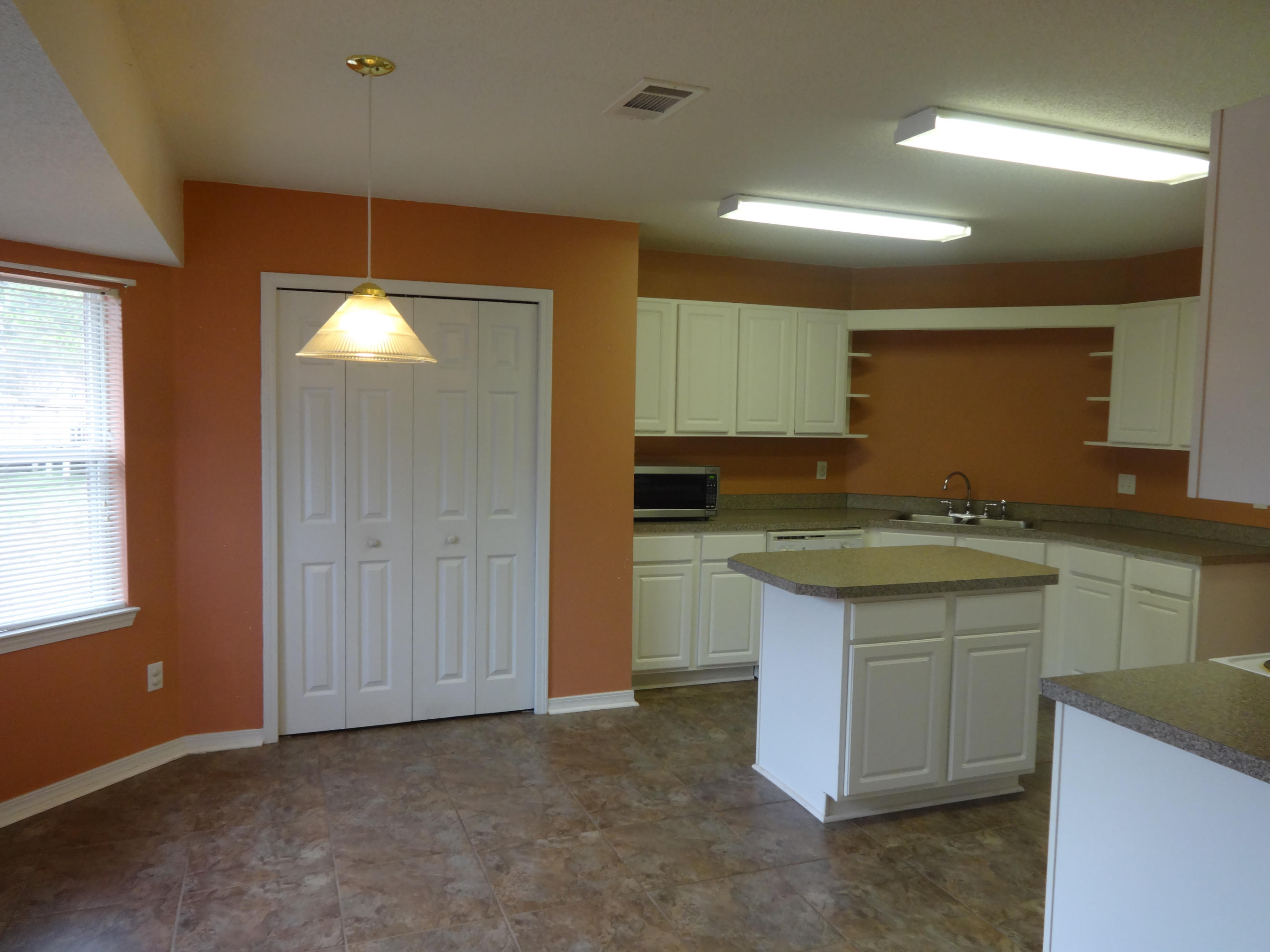 This 4 bedroom, 2 bath home has a split floor plan and a large family room, formal dining room, breakfast room, and a large kitchen with an island. Large master bedroom suite with a garden tub, separate shower, and a double vanity. There is a screened porch off the family room. 2 car garage. No pets