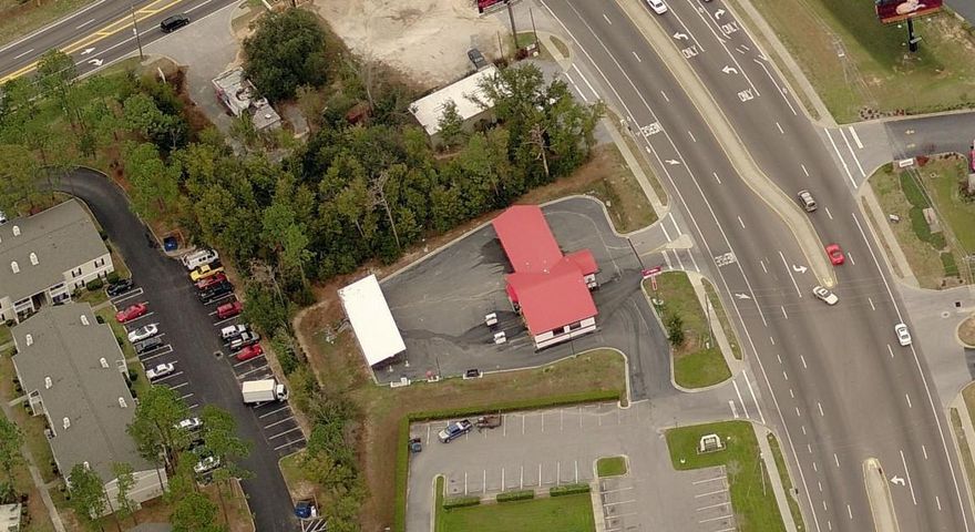 Originally designed as a car wash, the zoning for this parcel is C1, Retail Commercial, a cumulative zoning district allowing the potential for conversion to another retail use. The property provides over 2,000 SF of covered car wash area and 500 SF of storage/office space. It features 2 automatic bays and 3 manual bays, as well as, four covered vacuum stations and one open station. The site has direct access from a primary arterial plus potential additional access via easement.