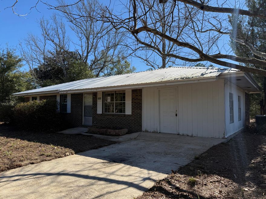 Located on a pleasant residential street, this 3-bedroom, 1-bathroom single-family home offers 1,008 square feet of functional living space and sits on a large 0.79 acre lot. NO HOA. The fully fenced yard includes an outdoor shed/barn, providing additional storage for vehicles, boats, tools and more. The interior features a sliding glass door leading to back patio and backyard. Located in the heart of Defuniak Springs, local amenities such as shopping, schools, recreation, dining and major highways have never been more accessible. This property presents a great opportunity for those looking to personalize a home or seek an investment opportunity. Don't miss the potential this home has to offer. Call and schedule your showing today.