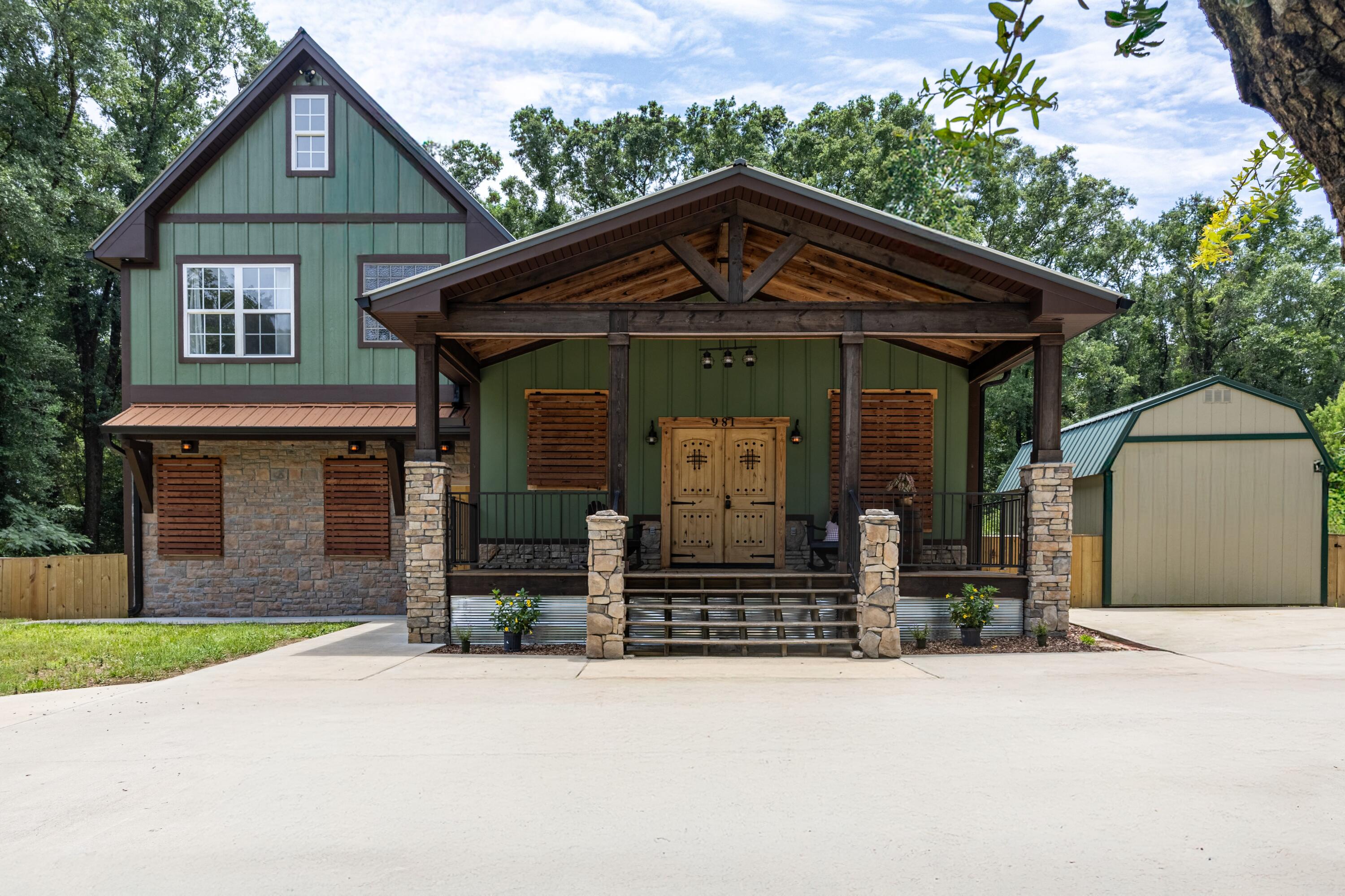 Gorgeous 5BR/3BA custom-built home completed in 2022 with no HOA and unmatched craftsmanship. Enter from the large covered front porch with rock pillars and wood beams through stunning custom double wood doors. Inside, enjoy granite countertops, stainless appliances, center island, and a trayed ceiling in the kitchen. Sunken living room features a color-changing electric fireplace that heats up to 900 sq ft. Main-level primary suite offers a spa-like bath with jacuzzi tub, tiled shower, dual vanities, and barn door. Additional BR and full bath on main level perfect for guests. Upstairs includes 2 BRs, full bath, and large loft that can be a 5th BR or flex space. Custom trim, wide doors, tile floors, and thoughtful layout throughout. This one stands apart--don't miss it!