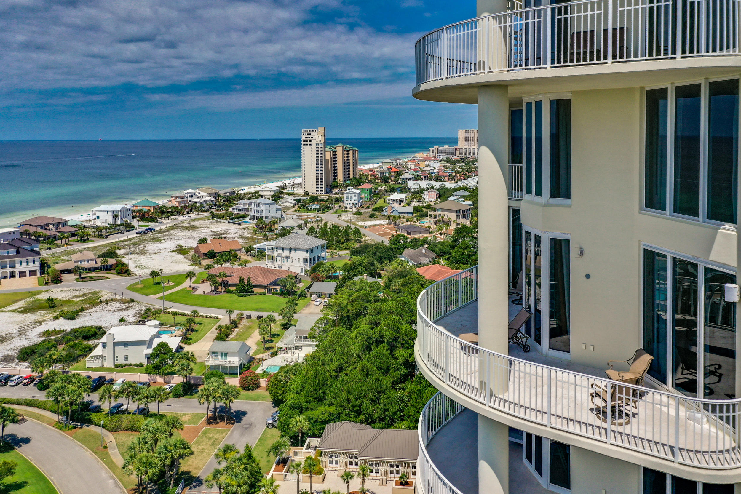 This luxurious penthouse property stands above the rest with a two car garage, and private pool side cabana making it one of the most sought after properties on the Emerald Coast. The Gulf views from this two-story penthouse condo in Sandestin's exclusive, gated, non-rental community of One Beach Club Drive are breathtaking. The spacious living room with vaulted 25 foot ceilings allows for ample sunlight to pour into the condo. Sliding doors from the living room lead out to the deep balcony overlooking the emerald waters of the Gulf of Mexico. The gorgeous floors with unique bamboo inlay welcome you into your FIVE bedroom five and a half bathroom penthouse. A