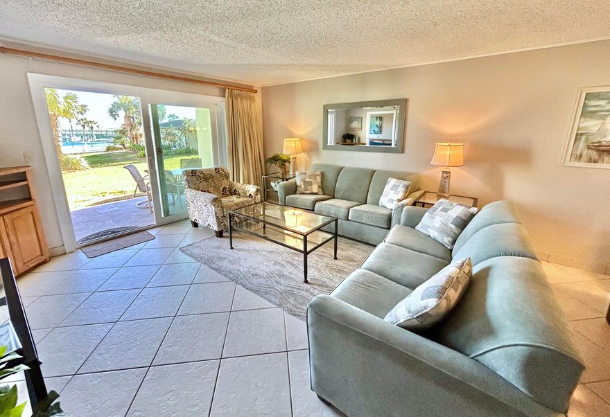 This Superclean 1st Floor Walk out is in a Highly desired location! Step out to the beautifully landscaped green space directly across to your beach access & pool area! No elevators or stairs! You'll  love the walk up & parking convenience!This Light & Bright condo sleeps 6. Unit has a festive feel & some nice upgrades. It's offered fully furnished & turnkey. You'll love this well kept building, manicured grounds & well managed fiscally! Islander passed all Building inspections & just got a new Paint Job w/in budget w/ generous reserves! Enjoy Tennis, Pickleball and Basketball! Onsite management w/ friendly staff welcomes you! Rented occasionally. Lots of owner use. Priced to sell!