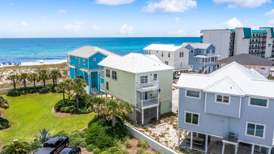 Welcome to 8265 Gulf Boulevard in the beach enclave of Summer Place with only 7 homesites of which 4 are gulf front.  Don't miss this rare opportunity to own just one position from the beach front as you are just steps from the white sandy beach.  This 5 bedroom 3 bath beach house is being sold ''AS IS'' and is located next to Belle Mer and is positioned to capture views to the southeast and southwest.  There's plenty of room for entertaining family and friends.   The top level with open floor plan features the Main Living Area. The kitchen with gracious wrap around bar marries the living room and dining.  The spacious Master Suite features a master bath with soaking tub, separate shower, and dual vanities. The 4 guest bedrooms are on the 2nd level. The first level features a foyer with dual entry from the covered space under the home which provides convenience when coming in from the beach or grocery shopping, and guests arrive through the front door entry.  We invite you to discover why families love to live and play at Summer Place!  This home is ready for your personal brushstroke and updates to the interior and exterior.  Summer Place on is one of the most premier beach locations for a beach house on Navarre Beach!  May be enjoyed as a rental or second home.  Easy to see!  Call today!  8265 Gulf Boulevard awaits!