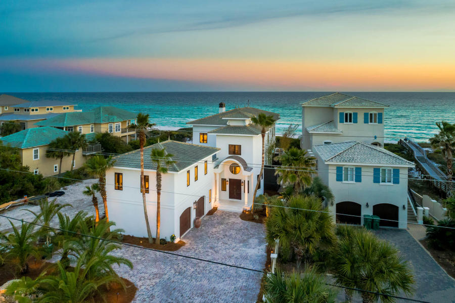 Experience luxurious gulf front living on 30A. Stunning architecture and spacious design characterize this private beachside retreat. Towering over the Gulf of Mexico, the emerald water views from every room are breath taking. This estate features a lavish large gulf side pool, private beach walk-over and a well-equipped summer kitchen to create the ultimate outdoor living space. This 5,743 square foot home offers 3 king suites, 1 queen suite, 2 bunk rooms, and 6.5 bathrooms; comfortably sleeping 24. The property boasts an enormous great room overlooking the Gulf of Mexico featuring a chef's kitchen, shuffle board table, dining for 16, wet bar, huge living area and a grand fireplace. The massive wine cellar is situated within the incredible tasting room featuring an additional wet bar