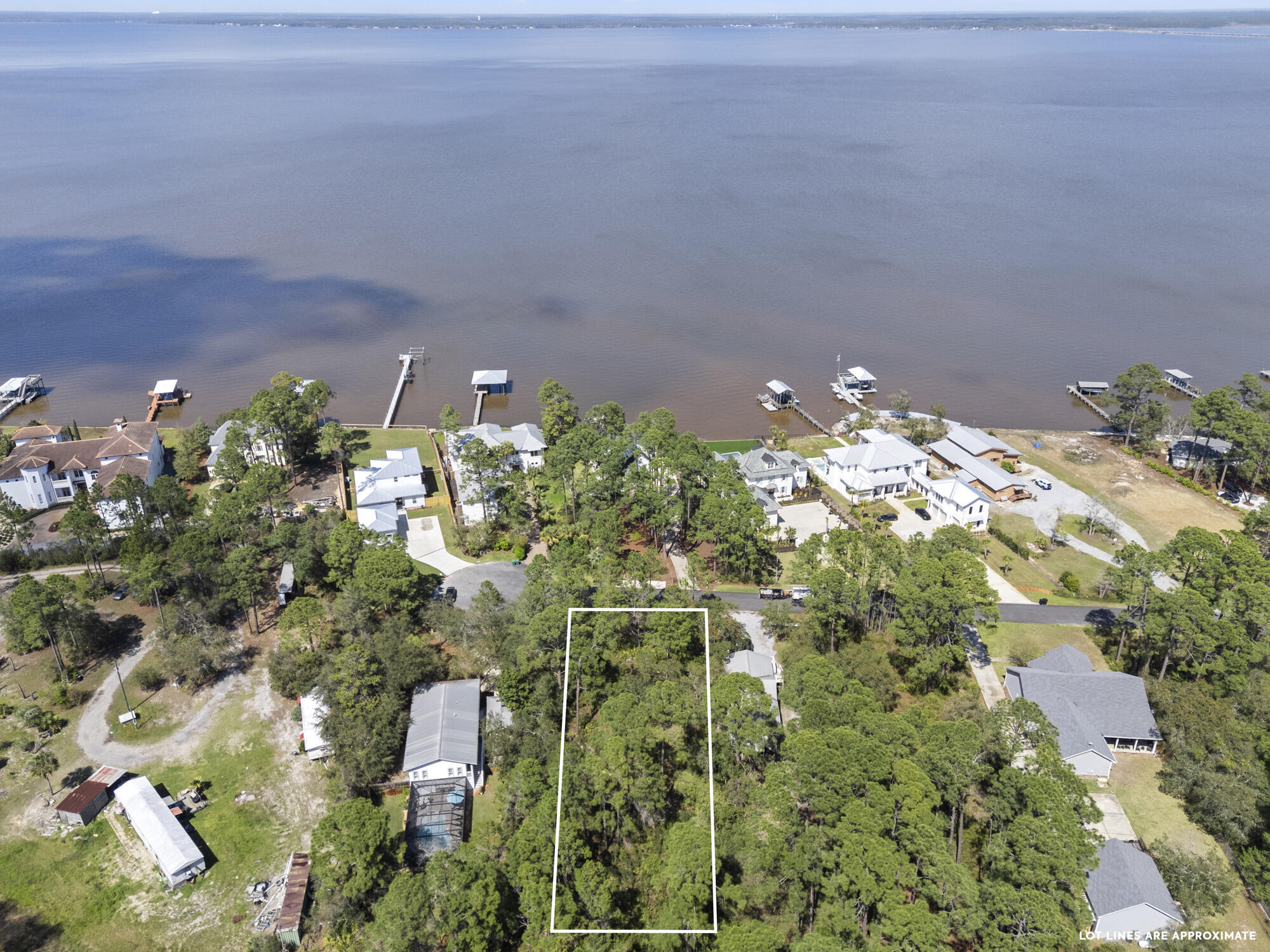 BUILD your DREAM home on this stunning 0.51-acre lot boasting captivating bay views! Situated in the sought-after Bay Pine Shores subdivision, mere minutes from the pristine 30A beaches, Cessna Boat Ramp, Kellogg Park, dining, shopping, the vibrant entertainment scene of Santa Rosa Beach & in the works 10,000 seat amphitheater with walking trails just up the road! Your dream lifestyle awaits! Survey Available. No wetlands. Buyer to verify all information.