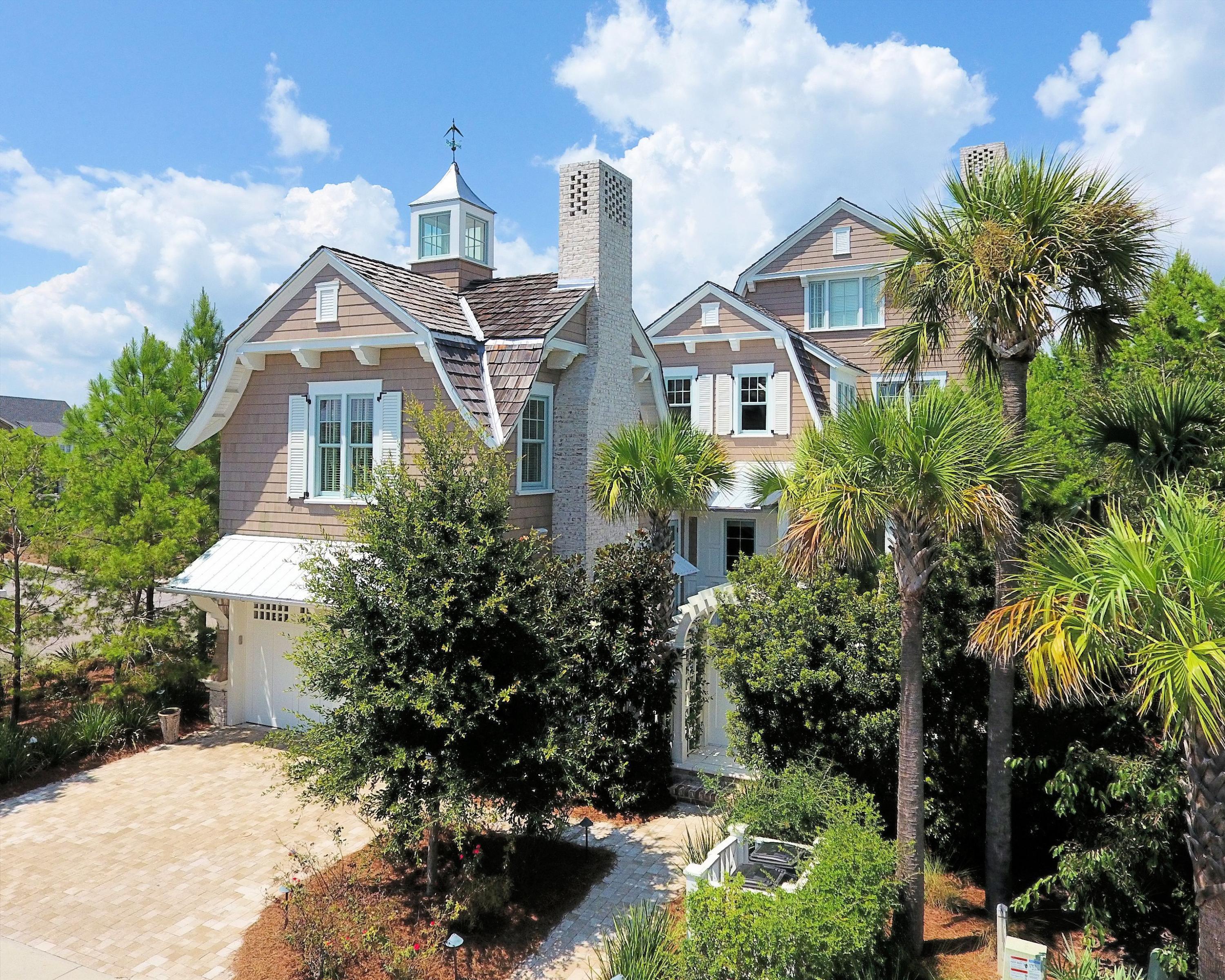 REDUCED $200,000. High End Finish Levels at this price point and price/sqft should not be missed. Featured in Elegant Home Magazine, Architect T. S. Adams designed the shingle styled home to create an amazing, window-filled, two story homeowner's dream. The home is surrounded on a corner lot with pine trees, magnolias and palm trees to create a private retreat within walking distance to Gulf of Mexico. There are four bedrooms with the potential for a large fifth bedroom; 4.5 baths, heated floors, antique beams, reclaimed white washed oak floors; shiplap and high end wood trim throughout every room. The three story grand staircase is the focal point of the first floor. Home has soaring ceilings with arched beams. It will take your breathe away. Seller will entertain selling some of the furnishings that coordinate with the home. The entry patio can accommodate a pool or water feature next to the completely equipped Viking outdoor kitchen and gas fireplace.
WaterSound amenities include neighborhood pools, clubhouse, fitness center, foot paths, dune walk overs to the beach and a post office. As an owner, additional amenities are available through the purchase of one of three St. Joe Club & Resort memberships. Click on documents for add'l info. Buyers fee of .5% or purchase price payable to St. Joe Community Fnd and .5% of purchase price payable to WaterSound HOA at closing.