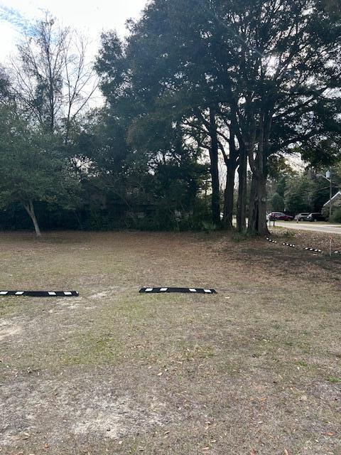 Great location! Located just 5/10th of a mile to downtown DeFuniak Springs. Directly across from the City Police Department, USPS and City Hall. The lot is 50x100 and it does not include the building next door. Survey is available.