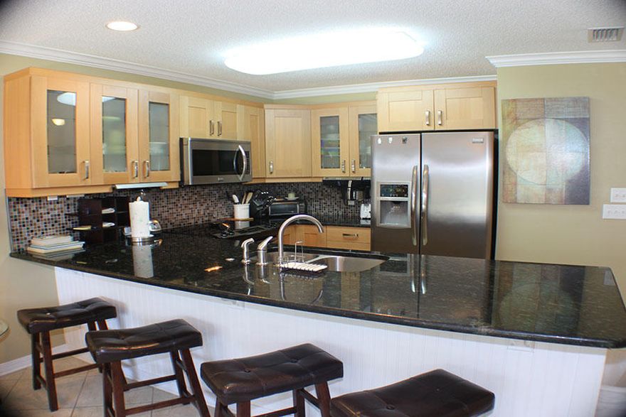 Maravilla 4104 is in building 4 on the ground floor with a partial view of the gulf down Maravilla Drive. For buyers wanting an excellent condo to produce rental income, 4104 had over $37K in rental income last year not including tax or fees managed by Beach Condos in Destin. This unit has been completely renovated with updated kitchen, bathrooms, lighting, furnishings, tile flooring, crown moldings, lighting for each bunk, wall mounted TV's LR/MBR,, counter top/in cabinet lighting kitchen and large capacity washer/dryer. Maravilla's deeded beach is a major asset, along with other amenities--tennis courts, clubhouse, 2 pools, hot tub, basketball goal, shuffleboard, beach volleyball, charcoal grills, and plenty of parking. Maravilla is family and pet friendly.