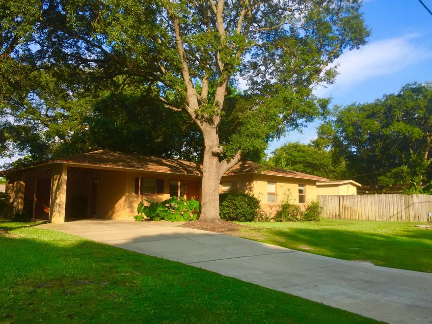 Cozy 1-owner home convenient to everything with a lovely shady lot. So much potential with solid cinder-block construction! Home Inspection available for buyers to review. Some repairs are completed. Great opportunity for expansion of the home. Brand new HVAC. Roof 2006. Copper wiring, but needs new electrical panel. Most windows double-paned.