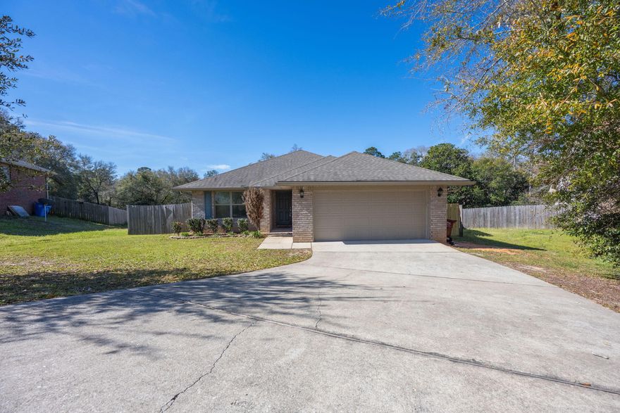 This home is spacious inside and out with 1,929 square feet of living space inside. The primary bedroom in the back of the home is extra large and features a beautiful ensuite with tile shower and garden tub. The back porch is covered to protect you from the elements while enjoying the natural view over your large backyard. With more than a quarter acre lot and fenced backyard, your options are many for how you spend your outdoor time. Don't worry about extra fees, there is no HOA and no flood insurance needed, this home is high and dry. The neighborhood is well maintained and conveniently located for good commutes in any direction. Welcome to Crestview, I can't wait for you to explore our beautiful community, attend downtown events, and patron the local businesses.