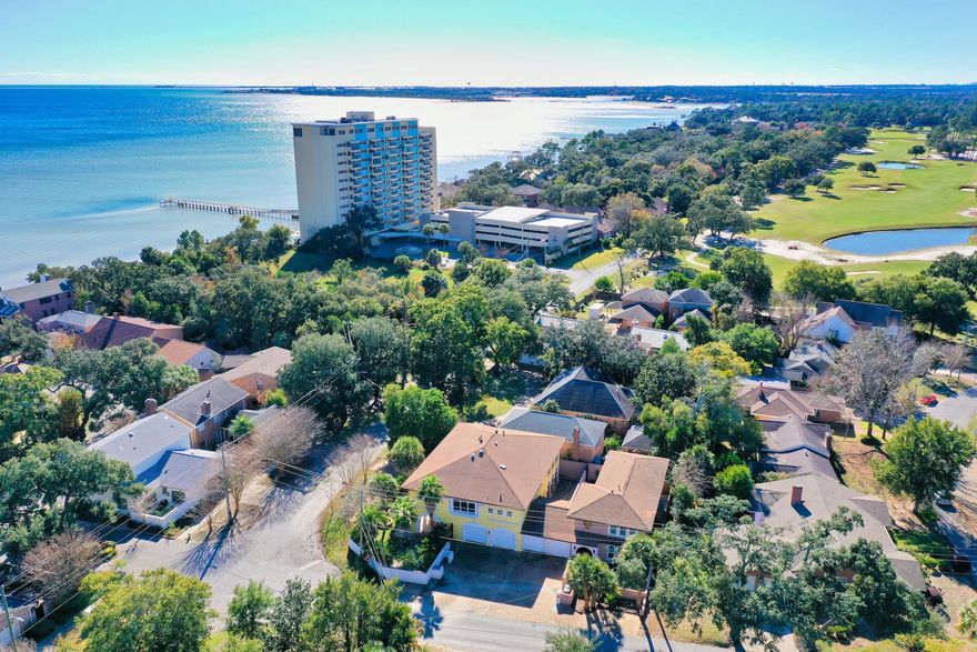 Welcome home! This landmark manor is situated on a corner lot just outside the Pensacola Country Club, just blocks from the Bay and minutes from downtown Pensacola. This beautiful home features 4 bedrooms and 4.5 baths with 2 separate living quarters. As you enter the private courtyard the stunning architecture is evident. Through the large bright foyer you will find elevator and stair access to the second floor along with separate entry to the downstairs living area. This space features an eat-in kitchen, living room and 2 bedrooms and baths with your own private courtyard and covered lanai. As you make your way to the second floor, the unique features of the home come to life with built in bookcases, chandeliers and columns. The kitchen features granite countertops, stainless steel