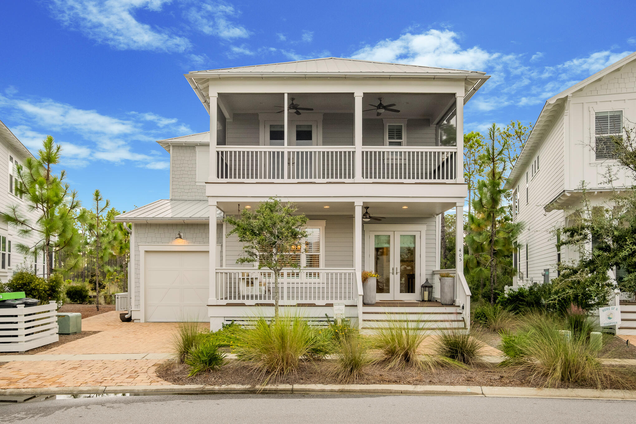 Here it is- your ticket to a fun beach house or your forever home! Rental projections are $99,000! This dual master suite home is spacious, light and bright and also being sold FURNISHED with high end furnishings! All the hard work has been done furnishing the home just right- so pack your flip flops and come visit! Front porch overlooks a swing set and green area for the kids to play and also a pickle ball court nearby. Tons of upgrades from beamed ceilings, wood floors throughout, designer lighting, plantation shutters, screened porch, etc! Kitchen features shaker style cabinets all the way to the ceiling with quartz countertops, subway backsplash, and built in appliances including gas cooktop. Living room is comfy & cozy.
