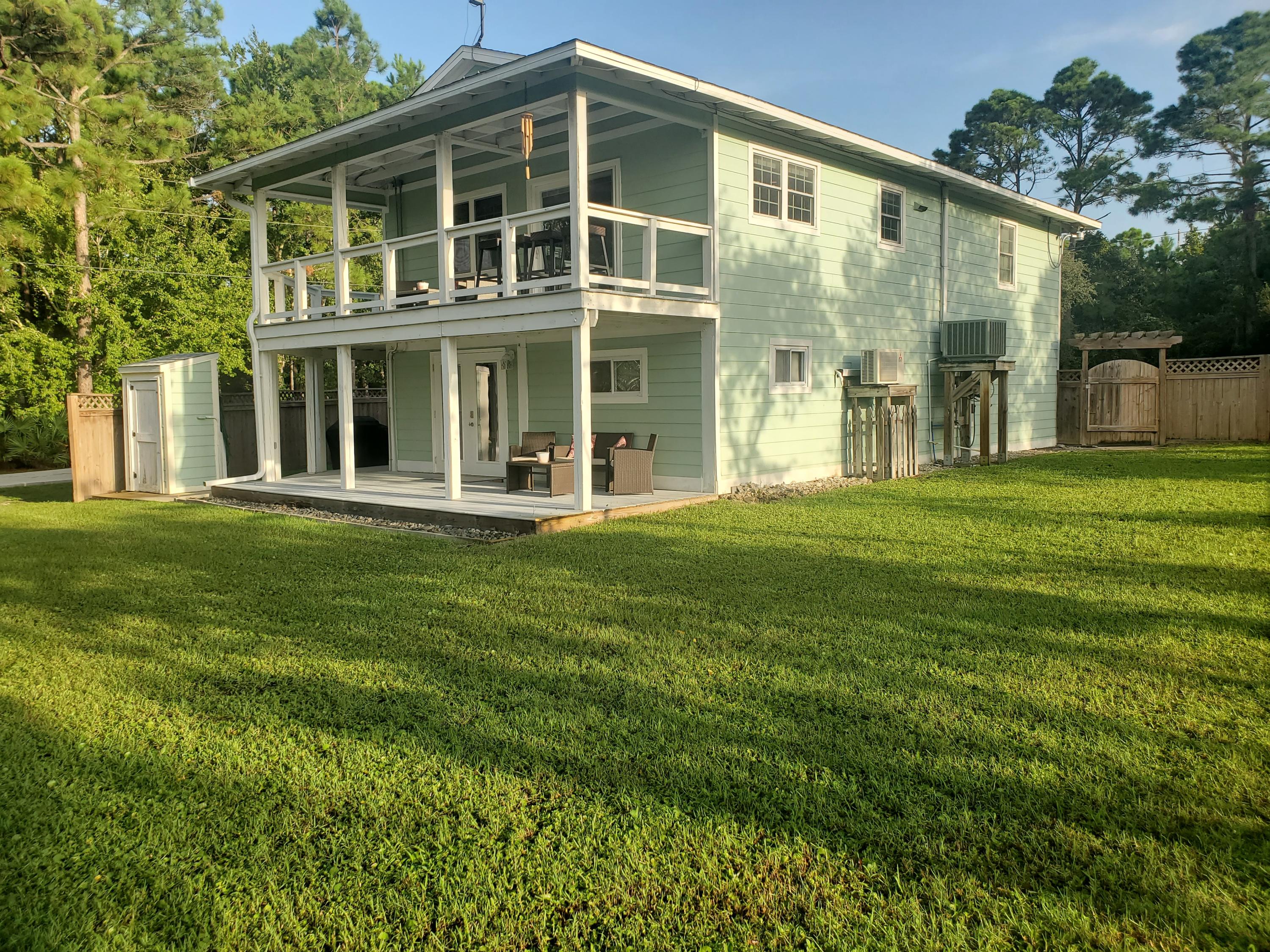 ***Back on the Market*** after multiple offer contract fell through. Enjoy the beautiful outdoor space and the craftmanship throughout this gorgeous home! The exterior features two wrap around porches with wonderful views, privacy fence, sprinkler system, and a well-maintained lawn area. The interior showcases many amenities including Brazilian hardwood floors, plantation blinds, Pella windows, and beautiful light fixtures. The kitchen has custom, soft-close cabinetry, granite countertops and all new appliances. The bedroom closets have built-in shelving and the bathrooms have granite countertops. The property also features Hardie plank siding, a GE Hybrid water heater, and a Dahua security system. The property is a short drive away from Navarre Beach and Hurlburt Field.