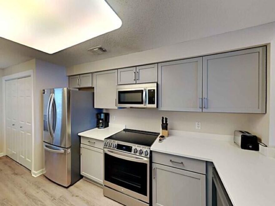 Experience luxury living at its finest in this stunning 2-bedroom, 2-bath, fully-furnished condo on the pristine white sandy shores of Navarre Beach. With breathtaking, exceptionally amazing views of the emerald Gulf, this turnkey residence is ready for you to move in and start enjoying the coastal lifestyle.As you enter, you will be greeted by a gorgeous coastal color palette and wood-look flooring that seamlessly flows through the living, kitchen, and bedrooms. The kitchen boasts updated cabinetry, ample counter space, and stainless steel appliances, perfect for preparing a fresh catch after a day on the water. The dining area and living room are also seamlessly connected, providing a sense of flow throughout the unit.