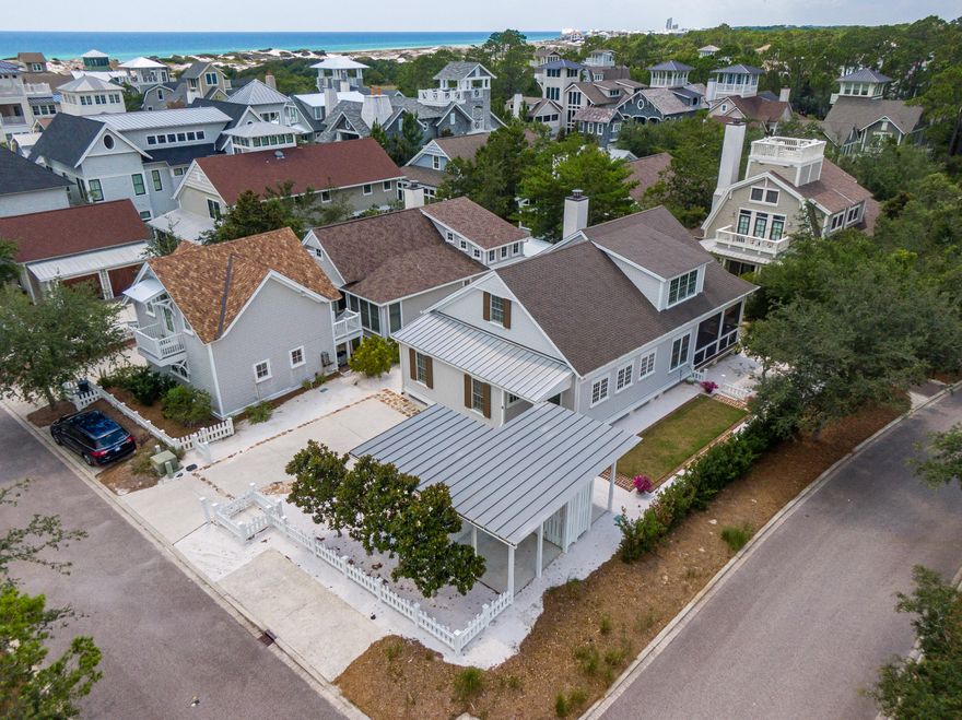 Enjoy classic coastal charm at this inviting WaterSound Beach residence situated on an oversized corner homesite. Step out the front door & it's just a few steps down the boardwalk to access the Gulf of Mexico. Calming colors mixed with warm toned wood floors highlight comfortable spaces designed for easy living. The gourmet kitchen includes Viking appliances, a glass subway tile backsplash, two dishwashers, two ovens, two refrigerators & center island for extra prep space. The living area features a fireplace, shiplap walls & two separate sitting areas. A first-floor master suite offers a luxurious master bathroom with a separate tub, walk-in shower, dual vanity with make-up area & built-in storage plus a custom walk-in closet. The office area includes custom built-ins & the laundry has additional storage. Upstairs, find three guest bedrooms each with their own ensuite.  Enjoy the wraparound screened porch after a day at the beach.  There is also the low maintenance yard with white picket fence, covered parking & an outdoor hot and cold shower. Other special features of the home include Pella high impact windows, quarter sawn white oak floors and a private well for irrigation.
Both sophisticated & stylish, the gated WaterSound Beach community located south of Scenic Highway 30A offers homeowners a rare sense of seclusion with easy access to area activities. Amenities include swimming pools, a puttering park, community green spaces, a state-of-the-art fitness center & private boardwalks to one of the most beautiful mile stretches of coastline in the area.  Don't miss this special opportunity!
