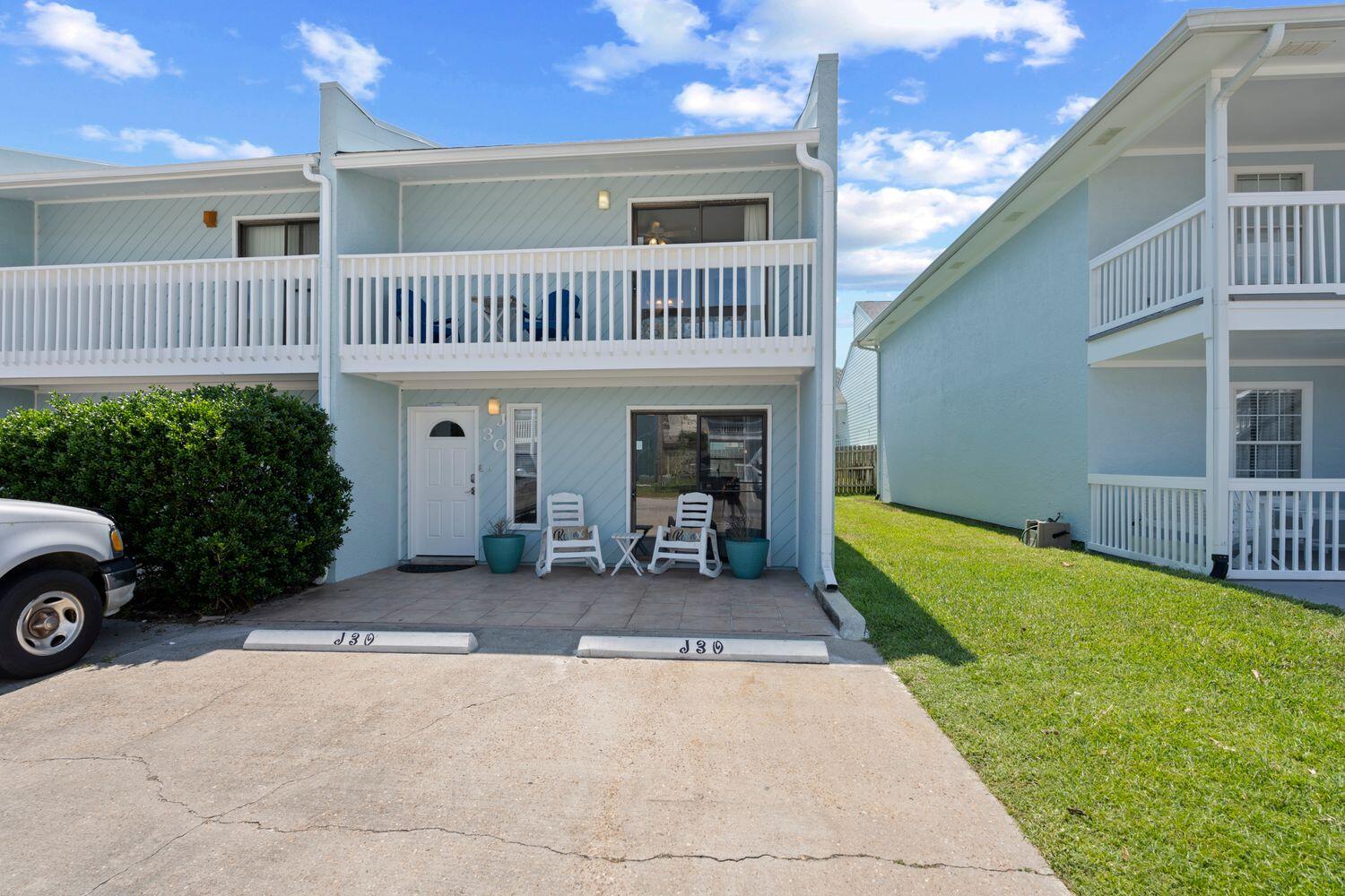 Moments to the beach and turn-key!Perfectly positioned for convenient access to the sugar white sands of the Emerald Coast, find this incredibly maintained & updated, two-bedroom, fully-furnished townhome with no HOA and an optional amenity access within Wendwood of Panama City Beach. Approaching the end-unit residence you'll notice the freshly painted exterior creates a warm welcome to your beach retreat and ushers you inside to the main living space. The living room is filled with natural light from the sliding glass door that creates a seamless indoor/outdoor lifestyle. While also providing ample space for friends and family to gather for an evening of board games and relaxation.