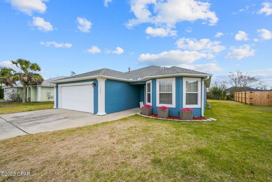 Recently updated and improved!Welcome to 1707 Scarlett Blvd - A Beautiful 3-Bed, 2-Bath Home in the Heart of Lynn Haven! Assumable FHA loan at 5.99% interest (approximately 1 full percentage point below today's rate). Mortgage balance is $278,000+/-. New backyard fence and all new interior paint. Possible flooring allowance can be provided with acceptable offer. Step inside this charming home located in the desirable Magnolia Meadows neighborhood. Featuring Brazilian cherry flooring throughout the main living areas, this home offers a spacious open-concept layout perfect for both relaxing and entertaining. Kitchen is decked out with newer stainless steel appliances. Enjoy three generously sized bedrooms, two full bathrooms, and a private backyard with fire pit, ideal for outdoor gatherings or playtime. Located within walking distance to Cain Griffin Park, you'll have access to ball fields, basketball courts, and a splash pad perfect for those warm Florida days. This home is also just minutes from dining, shopping, and top-rated schools, including the best public and charter school options in Bay County. Don't miss your opportunity to own this beautiful home in a fantastic location. Schedule your private showing today!