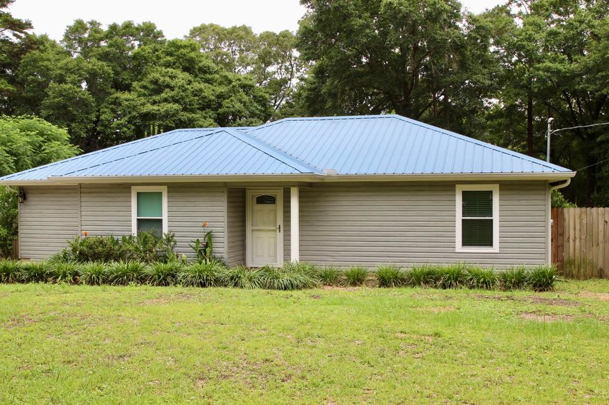 Recently remodeled, 3 bedroom 2 bath spit floor plan with a large bonus room. The double sized refrigerator will stay. Large laundry room. Custom deck with large flat fenced in yard. Separate fenced in garden area and the chicken coop, playground all stay. Homes is close to town but off the beaten path on a quiet road. Call today and schedule you tour before this home is Sold.