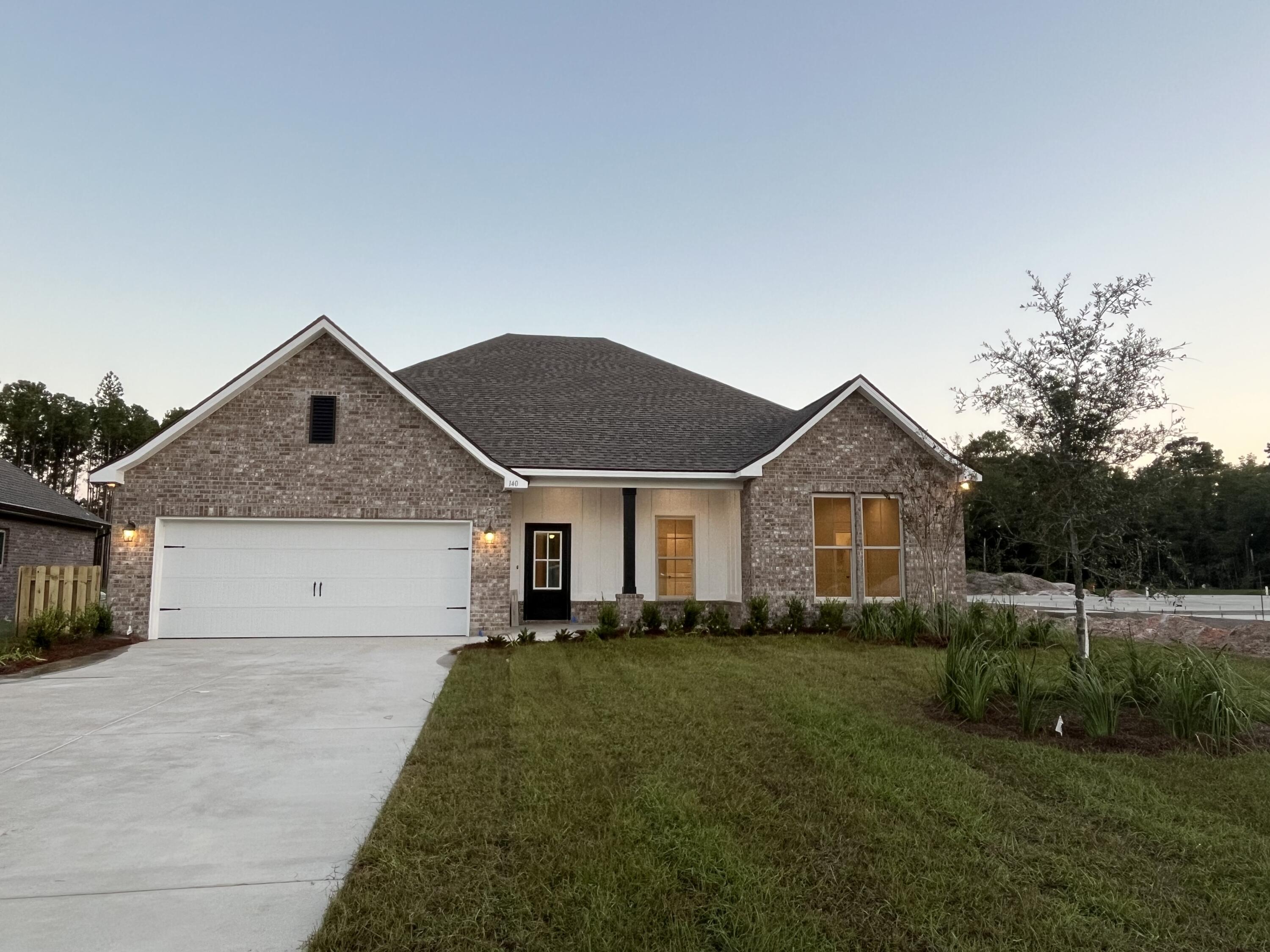 The COMSTOCK III G in Starburst at Hammock Bay community offers a 4 bedroom, 2 full bathroom, open and split design. Upgrades added (list attached).  Features: double vanity, garden tub, separate custom tiled shower, and walk-in closet in master suite, kitchen island, walk-in pantry, boot bench in mudroom, covered front porch and rear patio, walk-in closets, crown molding, recessed lighting, framed mirrors, smart connect WIFI thermostat, smoke/carbon monoxide detectors, landscaping package, architectural 30-year shingles, flood lights, and more!Energy Efficient Features: water heater, kitchen appliance package, vinyl low E windows, and more! Energy Star Partner.