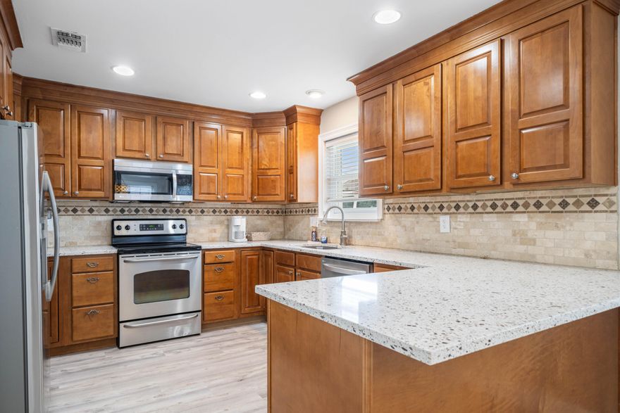 Discover Destin Holiday Isle living in this spacious, renovated townhome! The large kitchen features granite countertops and stainless steel appliances. Enjoy high ceilings in the living room with the master bedroom downstairs. Both full bathrooms are generously sized, and the property offers ample storage - including 2 large extra storage closets. Updates include new flooring, fresh interior paint, and newer windows & roof. Outside, relax on your private, fenced patio deck. Perks include walking to the beach (with a key fob to private access entrances), water taxi access to Destin Harbor, golf cart rides to local eateries, community canal access for paddle boarding or kayaking, and fireworks views from your backyard. Don't miss out on this gem and schedule your showing today!